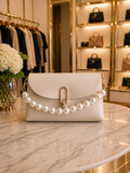 Pearl Princess Clutch in ivory with pearl handle and gold-tone accents